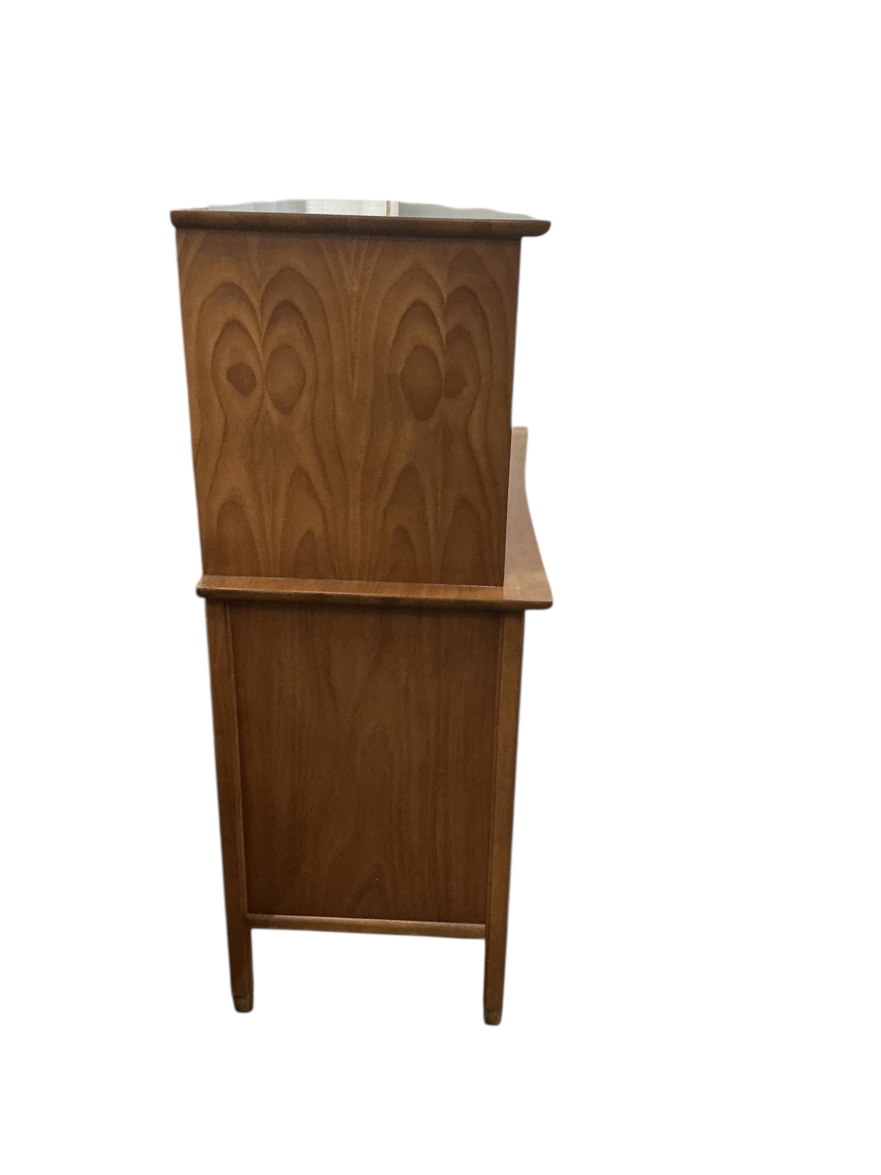 A mid century teak press cupboard, width 106cm, depth 49cm, height 128cm
